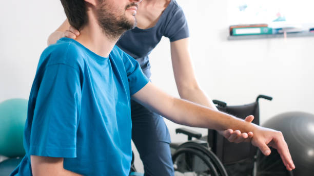 Doctor treating patient - Paralysis
